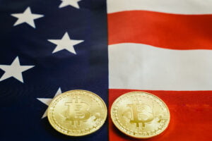 American flag background and two real bitcoin, new economy on the internet.